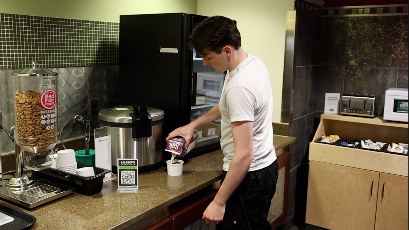 A student pours Silk milk at The Gallery at Snyder/Phillips, showcasing one of the many options for students with dietary restrictions on campus.