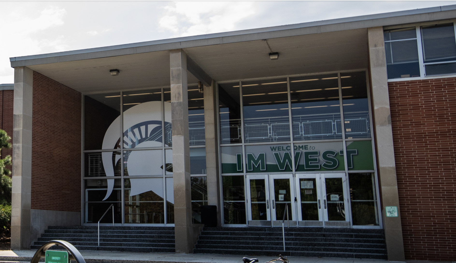 The entranceway to IM West, featuring a large Spartan helmet graphic.