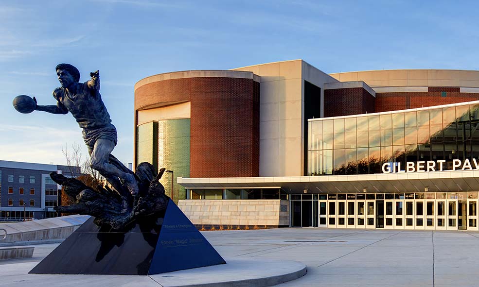 A statue of Magic Johnson sits outside of the Gilberty Pavilion at the Breslin Student Events Center on MSU's campus