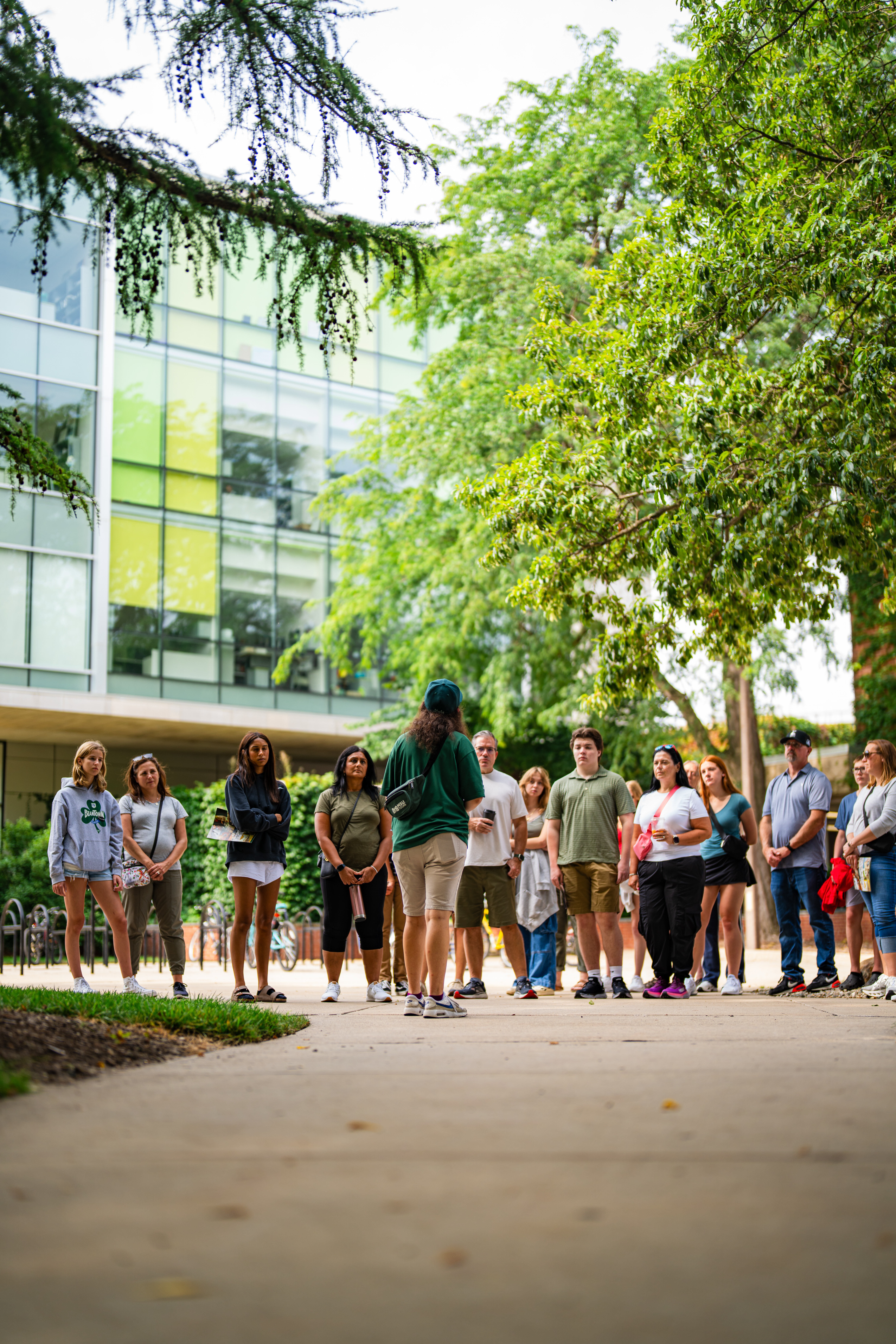 An MSU Tours student guide leads a group of visitors on a guided-tour on campus.