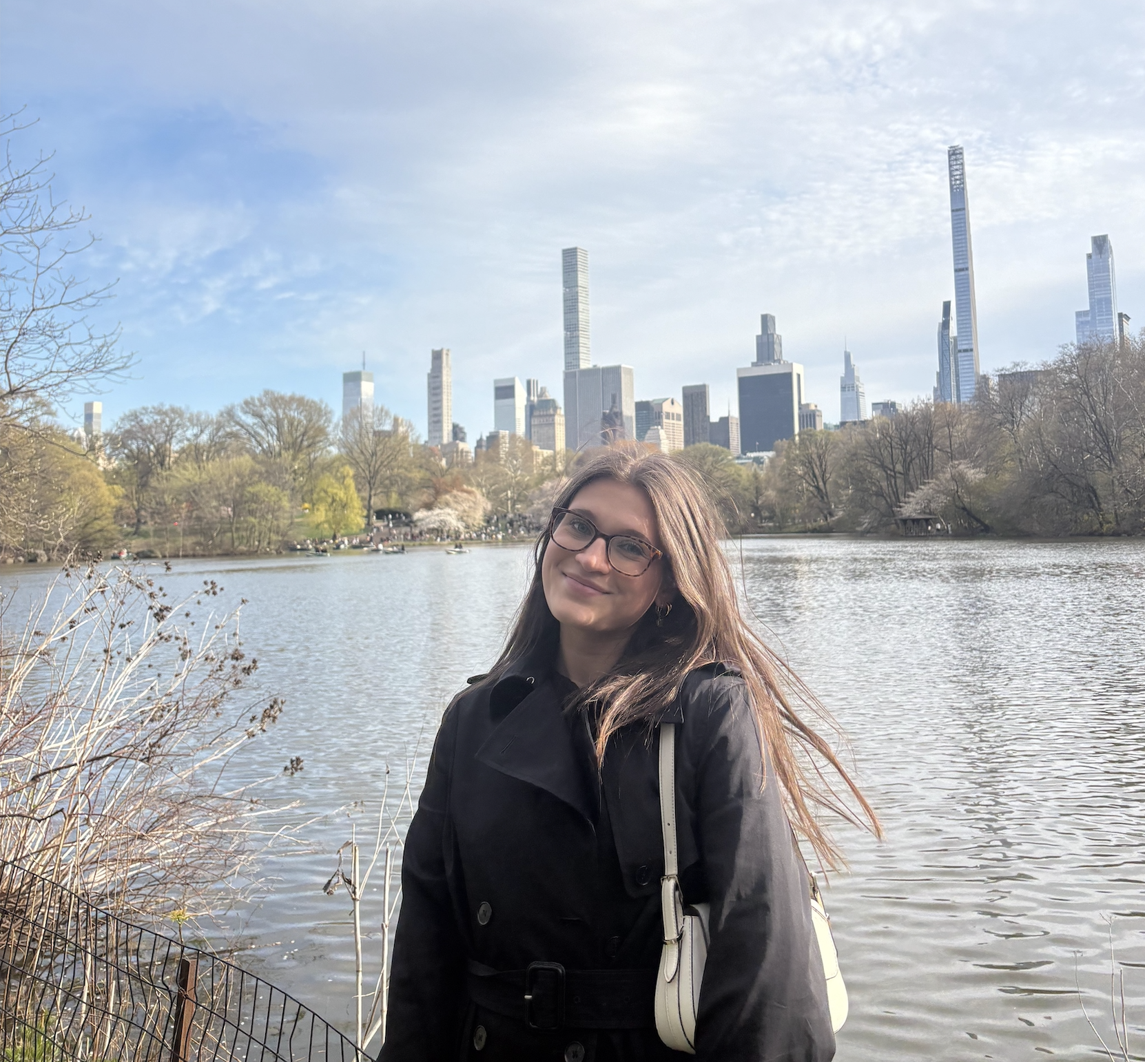 RCU Scholarship recipient Victoria Bucher poses on the waterfront in Central Park, New York City, with the city skyline in the background.