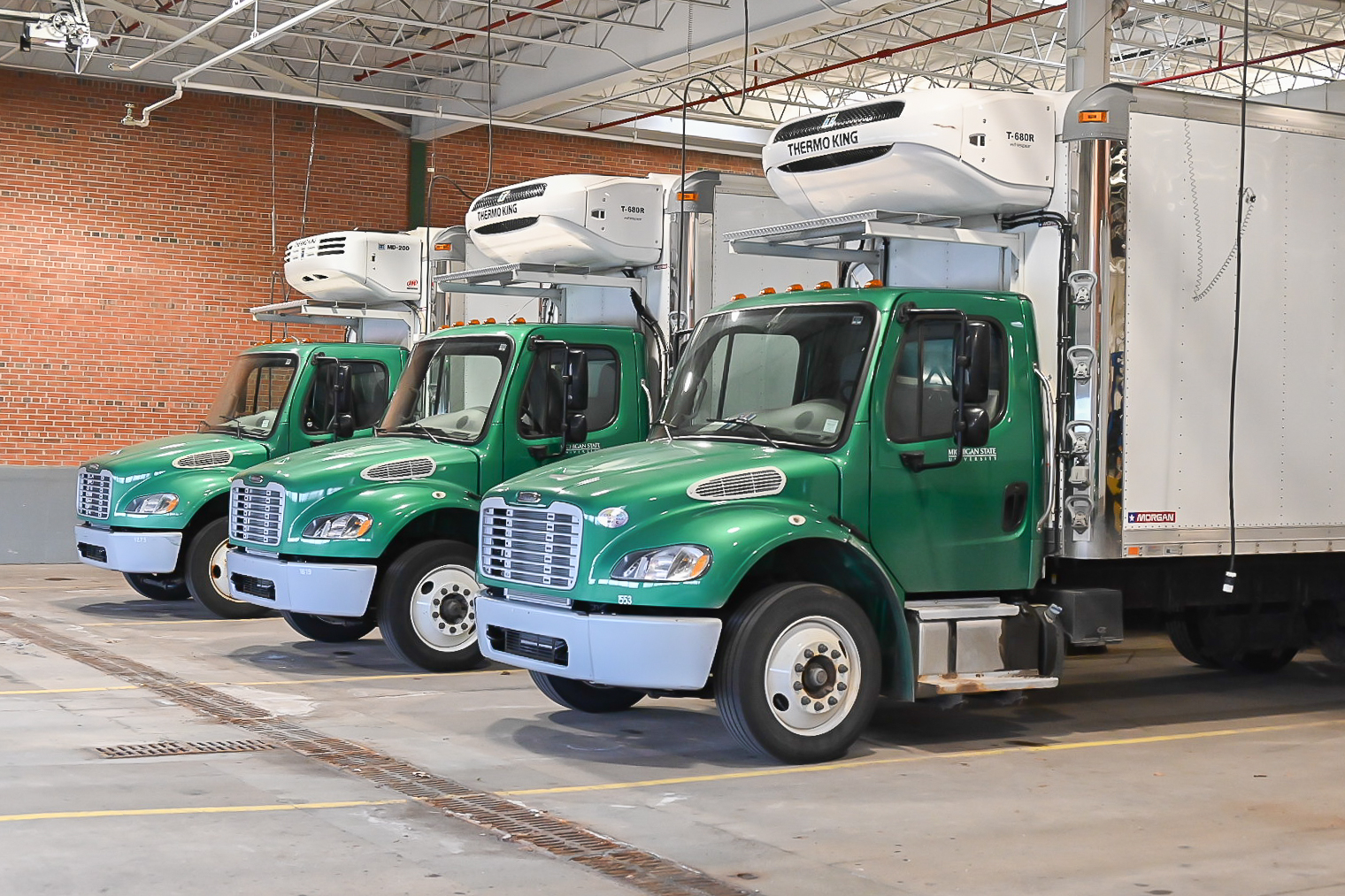 MSU Food Stores trucks parked at the warehouse.