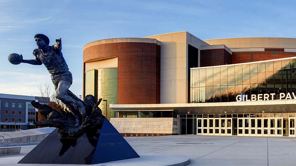 A statue of Magic Johnson sits outside of the Gilberty Pavilion at the Breslin Student Events Center on MSU's campus