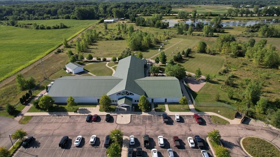 An overview shot of MSU’s Demmer Center showing the building, archery ranges and parking lot.