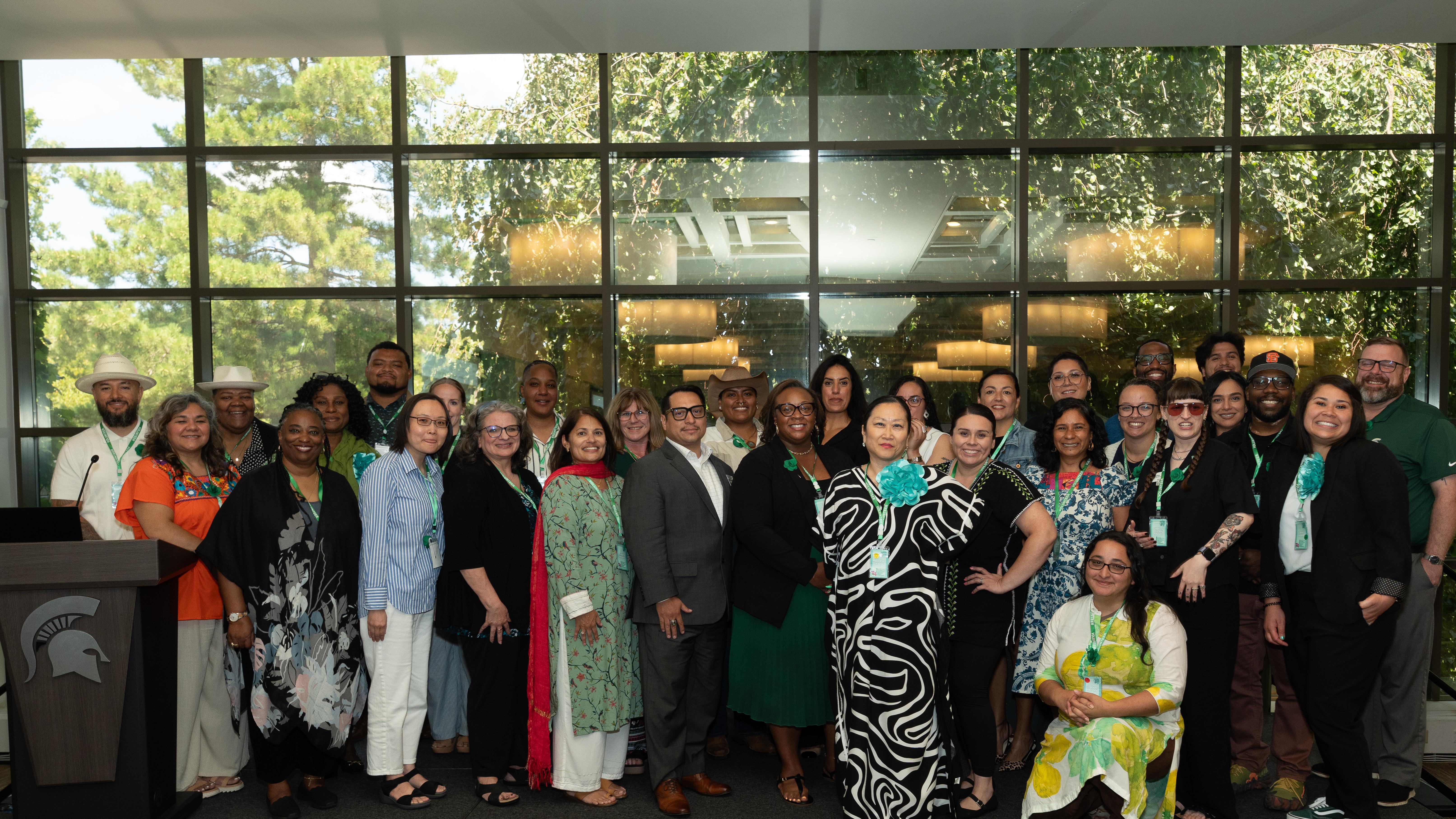 Presenters and committee members pose for a photo at the Inclusive Impact Conference